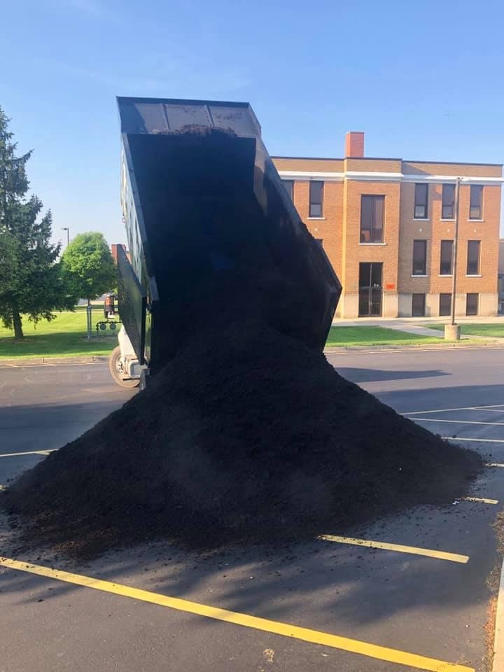 mulch being dumped out of a truck